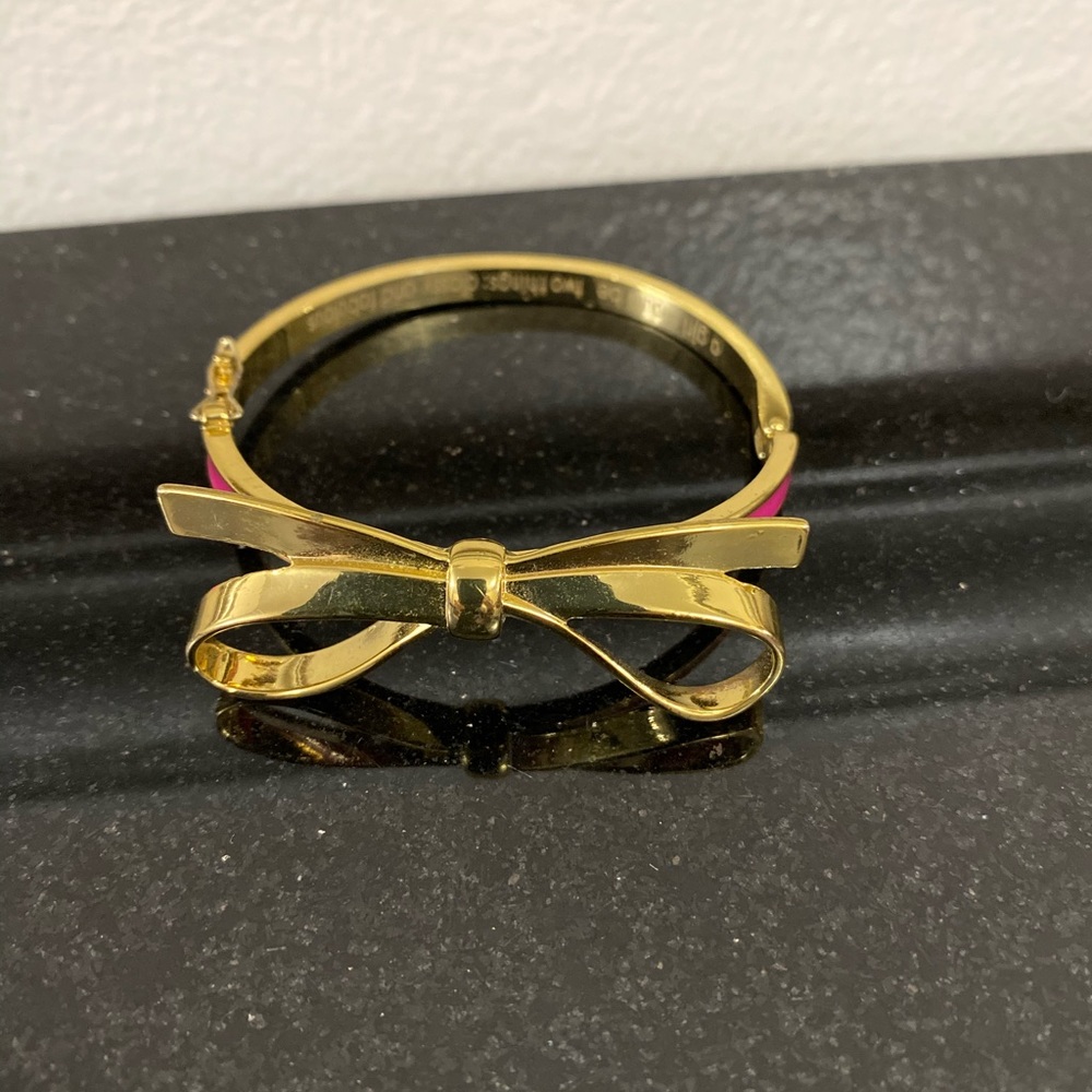 Skinny gold tone pink bow bracelets